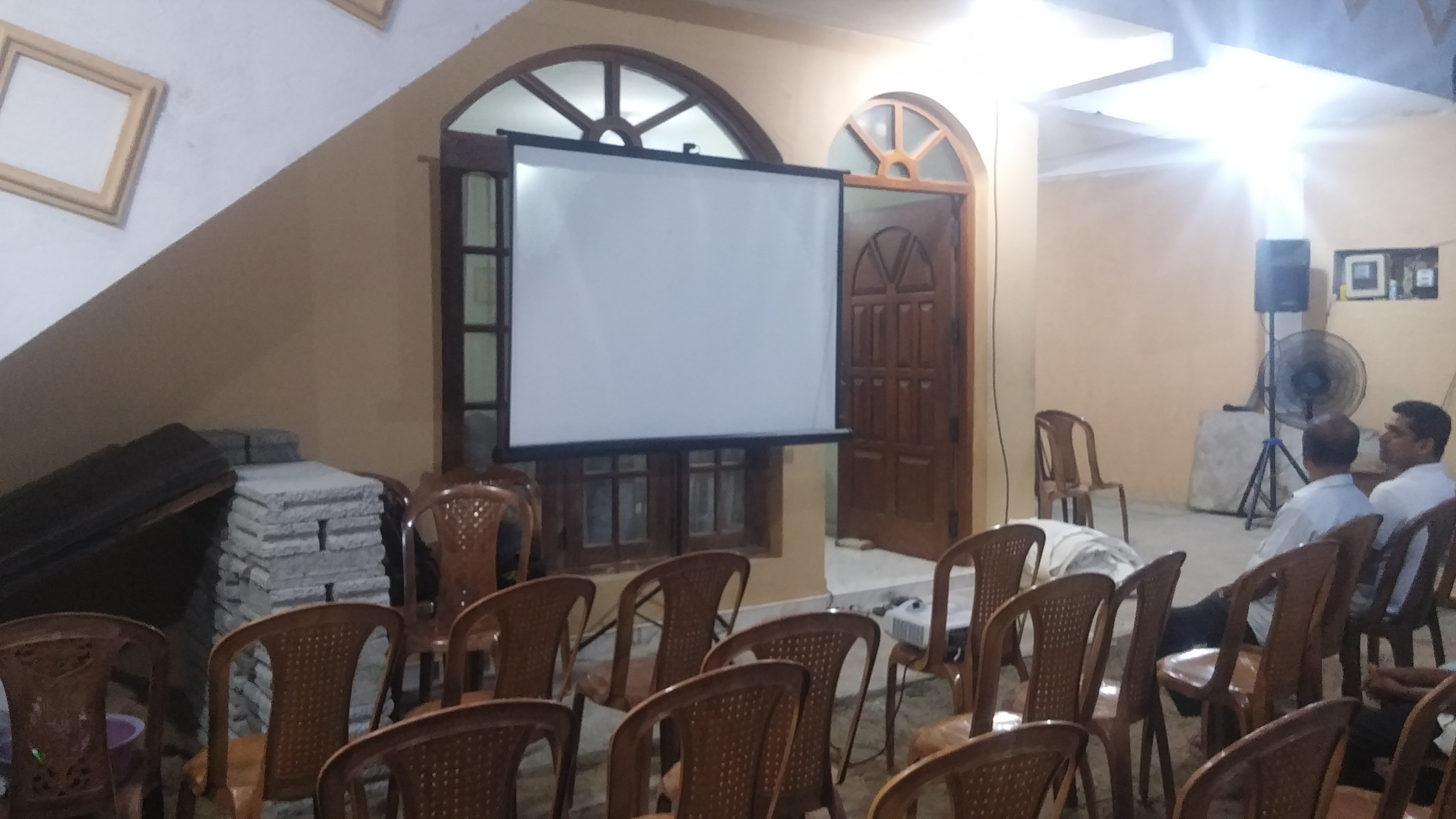 Generic Tripod 6 x 6 Ft 1:1 Projector Screen in action 1