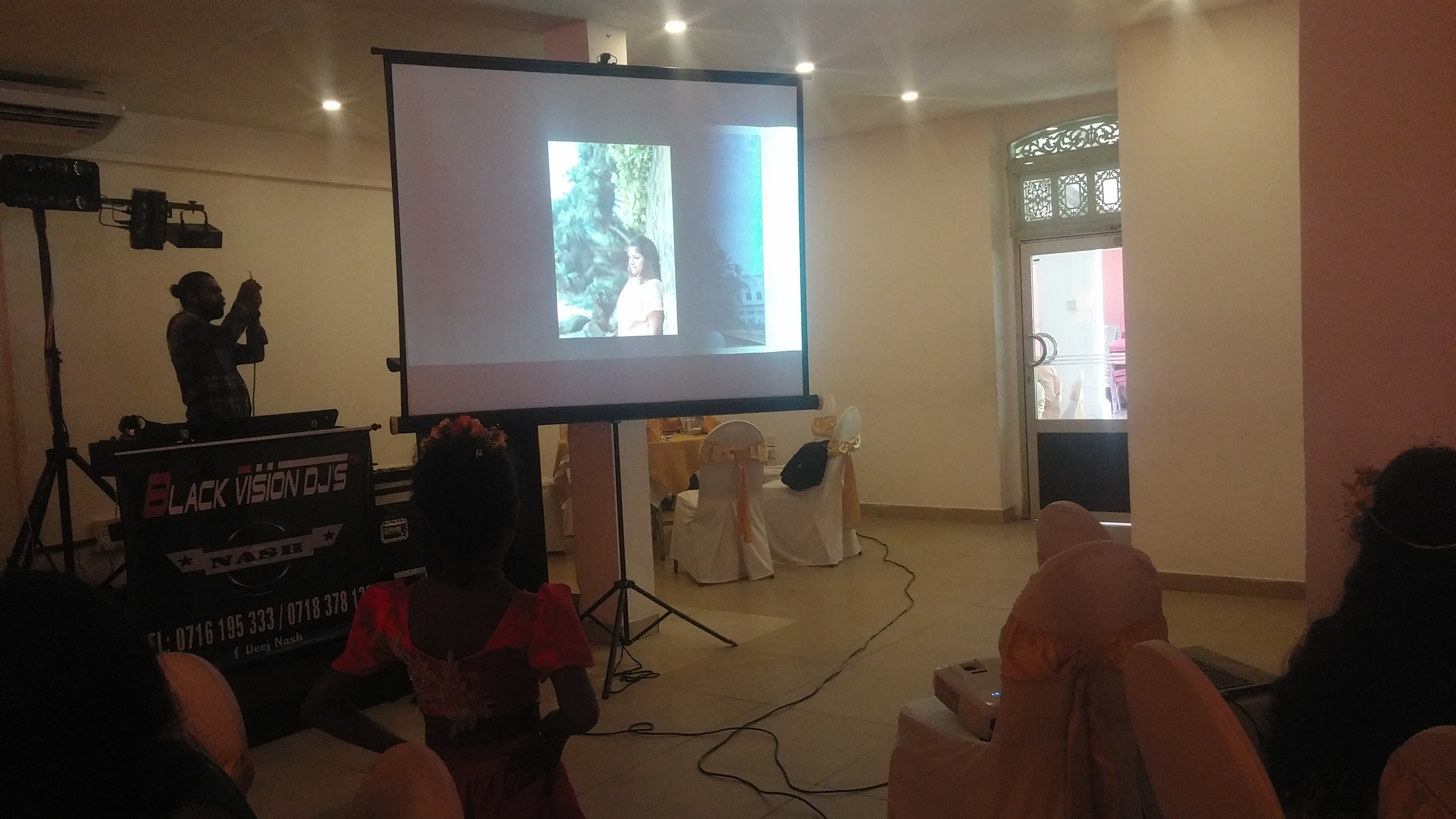 Generic Tripod 6 x 6 Ft 1:1 Projector Screen in action 4